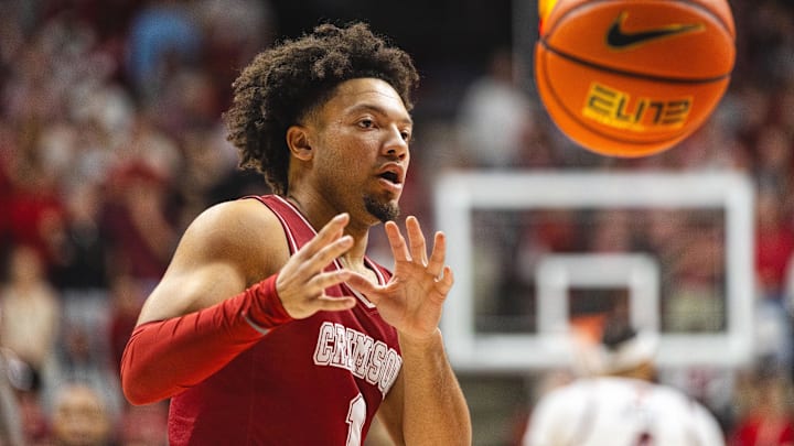 Feb 15, 2025; Tuscaloosa, Alabama, USA; Alabama Crimson Tide guard Mark Sears (1) receives the ball against the Auburn Tigers during the first half at Coleman Coliseum. Mandatory Credit: Will McLelland-Imagn Images