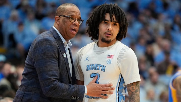 North Carolina Tar Heels head coach Hubert Davis with guard Elliot Cadeau (3) 
