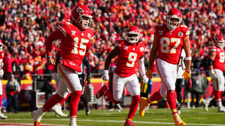 Dec 21, 2024; Kansas City, Missouri, USA; Kansas City Chiefs quarterback Patrick Mahomes (15) celebrates with tight end Travis Kelce (87) and wide receiver JuJu Smith-Schuster (9) after scoring a touchdown during the first half against the Houston Texans at GEHA Field at Arrowhead Stadium. Mandatory Credit: Jay Biggerstaff-Imagn Images