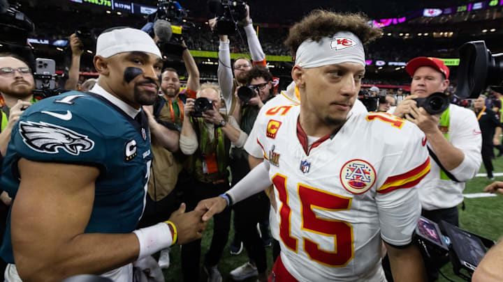 Feb 9, 2025; New Orleans, LA, USA; Philadelphia Eagles quarterback Jalen Hurts (1) greets Kansas City Chiefs quarterback Patrick Mahomes (15) following Super Bowl LIX at Ceasars Superdome. Mandatory Credit: Mark J. Rebilas-Imagn Images