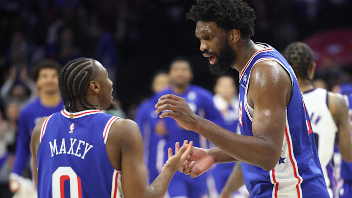 Jan 29, 2026; Philadelphia, Pennsylvania, USA; Philadelphia 76ers center Joel Embiid (21) reacts with Philadelphia 76ers guard Tyrese Maxey (L) after a victory against the Sacramento Kings at Xfinity Mobile Arena. Mandatory Credit: Bill Streicher-Imagn Images