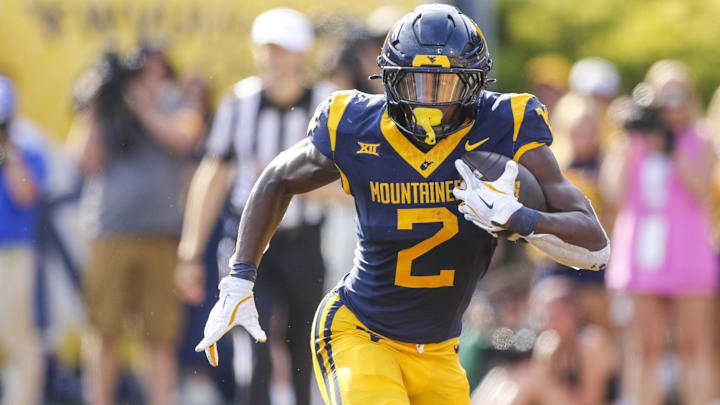 Sep 13, 2025; Morgantown, West Virginia, USA; West Virginia Mountaineers running back Tye Edwards (2) runs the ball during the second quarter against the Pittsburgh Panthers at Milan Puskar Stadium. Mandatory Credit: Ben Queen-Imagn Images Sep 13, 2025; Morgantown, West Virginia, USA; West Virginia Mountaineers running back Tye Edwards (2) runs the ball during the second quarter against the Pittsburgh Panthers at Milan Puskar Stadium. Mandatory Credit: Ben Queen-Imagn Images
