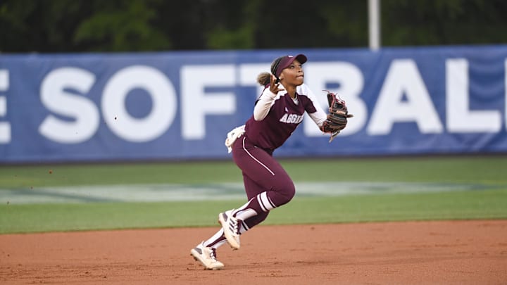 May 10, 2024; Auburn, AL, USA;  Texas A&M Aggies infielder Koko Wooley (3) bobbles a ground ball against the Florida Gators at Jane B. Moore Field. Mandatory Credit: Julie Bennett-Imagn Images