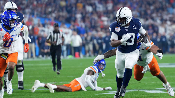 Penn State Nittany Lions running back Kaytron Allen (13) rushes the ball against the Boise State Broncos during the first half in the Fiesta Bowl at State Farm Stadium. Penn State Nittany Lions running back Kaytron Allen (13) rushes the ball against the Boise State Broncos during the first half in the Fiesta Bowl at State Farm Stadium.