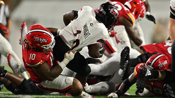Maryland Terrapins defensive lineman Cam Rice (10) drags down Northern Illinois Huskies running back Chavon Wright (10) in the second half at SECU Stadium in 2025. Maryland Terrapins defensive lineman Cam Rice (10) drags down Northern Illinois Huskies running back Chavon Wright (10) in the second half at SECU Stadium in 2025.