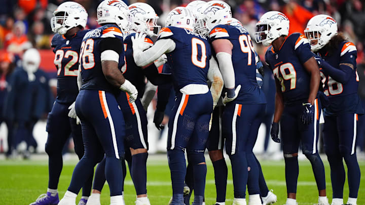 Dec 2, 2024; Denver, Colorado, USA; Members of the Denver Broncos defensive team huddle in the second half against the Cleveland Browns at Empower Field at Mile High. Mandatory Credit: Ron Chenoy-Imagn Images Dec 2, 2024; Denver, Colorado, USA; Members of the Denver Broncos defensive team huddle in the second half against the Cleveland Browns at Empower Field at Mile High. Mandatory Credit: Ron Chenoy-Imagn Images