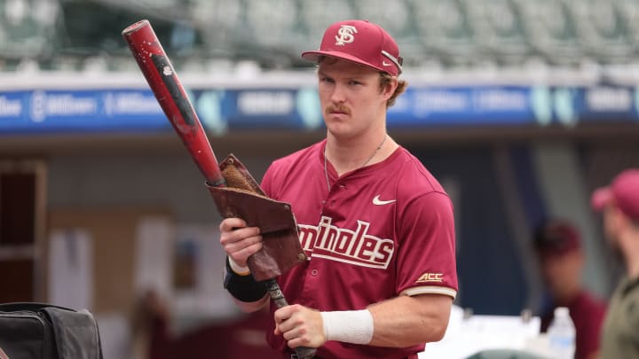 May 25, 2024; Charlotte, NC, USA; Florida State outfielder James Tibbs III (22) seen warming up before the game against Wake Forest during the ACC Baseball Tournament at Truist Field. May 25, 2024; Charlotte, NC, USA; Florida State outfielder James Tibbs III (22) seen warming up before the game against Wake Forest during the ACC Baseball Tournament at Truist Field.