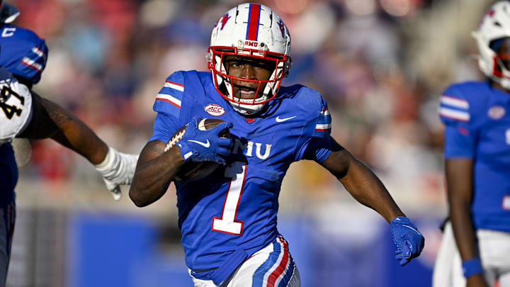 Nov 30, 2024; Dallas, Texas, USA; Southern Methodist Mustangs running back Brashard Smith (1) runs with the ball against the California Golden Bears during the first half at Gerald J. Ford Stadium. 