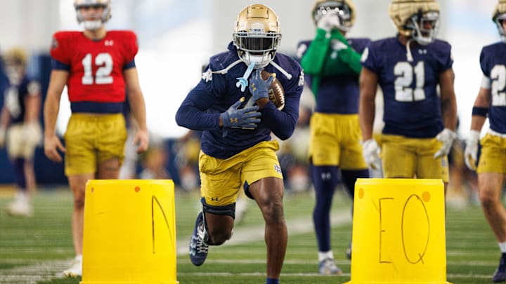 Notre Dame running back Jeremiyah Love (4) participates in a drill during a Notre Dame football practice at Irish Athletic Center on Sunday, Jan. 5, 2025, in South Bend.