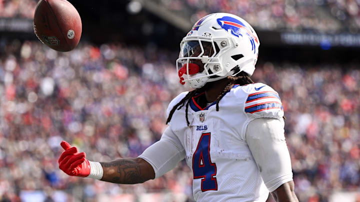 Oct 22, 2023; Foxborough, Massachusetts, USA; Buffalo Bills running back James Cook (4) tosses the ball after rushes against the New England Patriots during the first half at Gillette Stadium. Oct 22, 2023; Foxborough, Massachusetts, USA; Buffalo Bills running back James Cook (4) tosses the ball after rushes against the New England Patriots during the first half at Gillette Stadium.