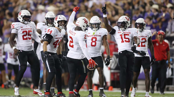 Oct 4, 2024; Fort Worth, Texas, USA; Houston Cougars defensive back A.J. Haulcy (2) celebrates making an interception against the TCU Horned Frogs with his teammates in the second quarter at Amon G. Carter Stadium. Mandatory Credit: Tim Heitman-Imagn Images
