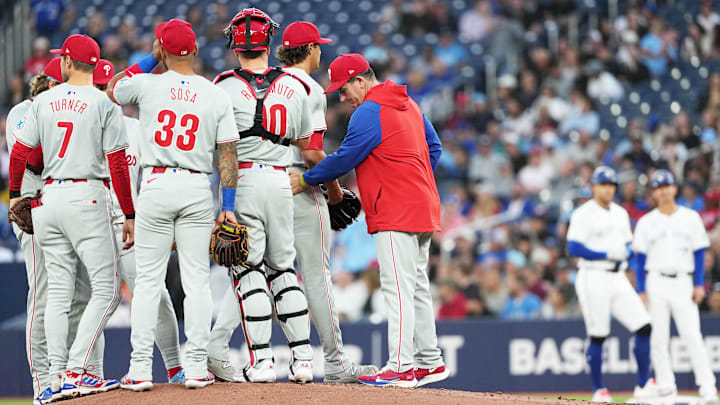 Sep 3, 2024; Toronto, Ontario, CAN; Philadelphia Phillies starting pitcher Tyler Phillips (48) is relieved by Philadelphia Phillies manager Rob Thomson (59) against the Toronto Blue Jays during the first inning at Rogers Centre.