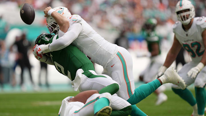 Miami Dolphins linebacker Bradley Chubb hits New York Jets quarterback Zach Wilson, causing a fumble.