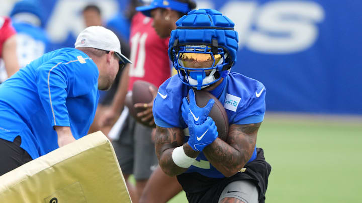 Jun 3, 2025; Woodland Hills, CA, USA; Los Angeles Rams running back Kyren Williams (23) carries the ball during organized team activities at Rams Practice Facility. Mandatory Credit: Kirby Lee-Imagn Images