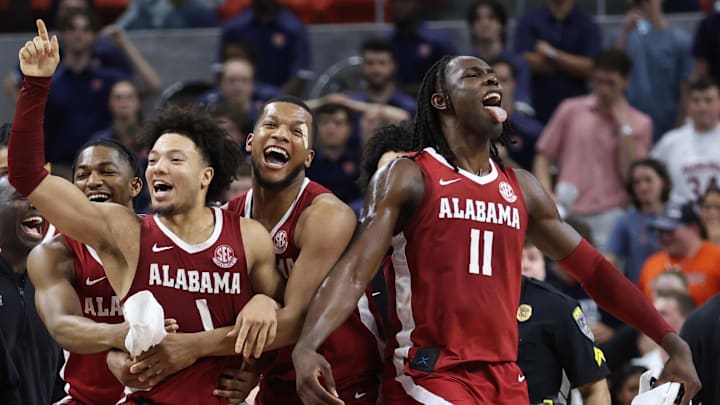 Mar 8, 2025; Auburn, Alabama, USA; Alabama Crimson Tide guard Mark Sears (1) celebrates after making the game winning shot to beat the Auburn Tigers in overtime at Neville Arena.