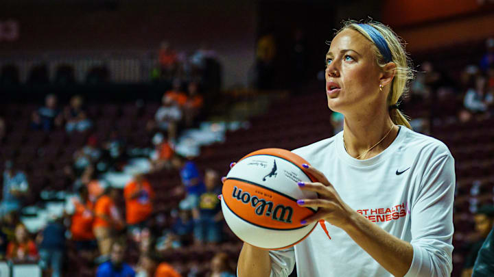 Aug 17, 2025; Uncasville, Connecticut, USA; Indiana Fever guard Sophie Cunningham (8) warms up before the start of the game against the Connecticut Sun at Mohegan Sun Arena. Mandatory Credit: David Butler II-Imagn Images
