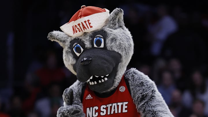 Mar 17, 2026; Dayton, OH, USA; The NC State Wolfpack mascot “Mr. Wuf” performs in the second half against the Texas Longhorns during a first four game of the men's 2026 NCAA Tournament at University of Dayton Arena. Mandatory Credit: Rick Osentoski-Imagn Images Mar 17, 2026; Dayton, OH, USA; The NC State Wolfpack mascot “Mr. Wuf” performs in the second half against the Texas Longhorns during a first four game of the men's 2026 NCAA Tournament at University of Dayton Arena. Mandatory Credit: Rick Osentoski-Imagn Images