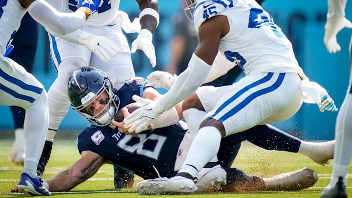 Tennessee Titans quarterback Will Levis (8) collides with Indianapolis Colts linebacker E.J. Speed (45) during the second quarter at Nissan Stadium in Nashville, Tenn., Sunday, Oct. 13, 2024.