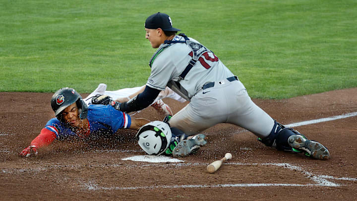 Rochester’s Andrew Pinckney is tagged out trying to score on a squeeze play by Scranton catcher Rafael Flores.