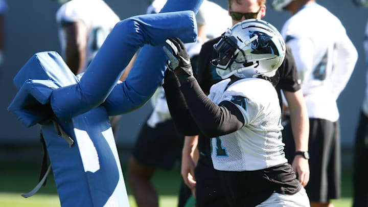 Carolina Panthers defensive end Bryan Cox (91) hits a sled during practice at Bank of America Stadium in 2019. Carolina Panthers defensive end Bryan Cox (91) hits a sled during practice at Bank of America Stadium in 2019.