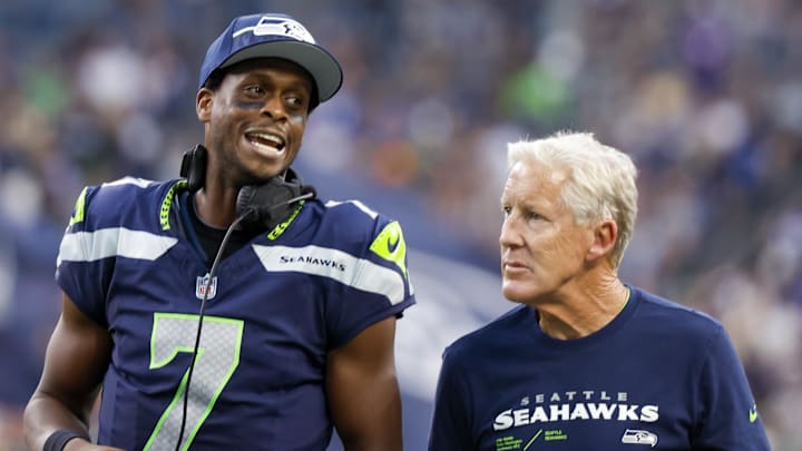 Aug 19, 2023; Seattle, Washington, USA; Seattle Seahawks quarterback Geno Smith (7) talks with head coach Pete Carroll during the second quarter against the Dallas Cowboys at Lumen Field. Mandatory Credit: Joe Nicholson-Imagn Images