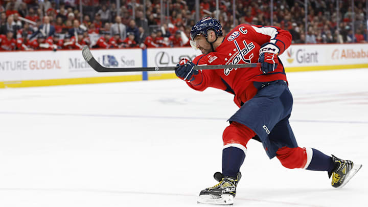 Mar 7, 2025; Washington, District of Columbia, USA; Washington Capitals left wing Alex Ovechkin (8) shoots the puck against the Detroit Red Wings in the third period at Capital One Arena. Mandatory Credit: Geoff Burke-Imagn Images