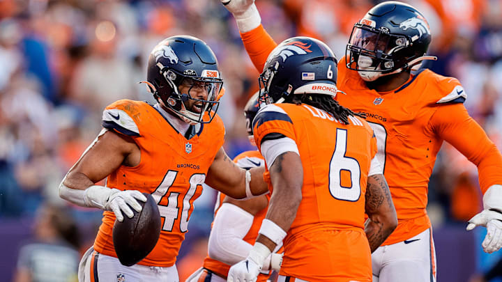 Oct 19, 2025; Denver, Colorado, USA; Denver Broncos linebacker Justin Strnad (40) celebrates his interception with safety P.J.L.ocke (6) and linebacker Jonathon Cooper (0) in the fourth quarter against the New York Giants at Empower Field at Mile High. Mandatory Credit: Isaiah J. Downing-Imagn Images Oct 19, 2025; Denver, Colorado, USA; Denver Broncos linebacker Justin Strnad (40) celebrates his interception with safety P.J.L.ocke (6) and linebacker Jonathon Cooper (0) in the fourth quarter against the New York Giants at Empower Field at Mile High. Mandatory Credit: Isaiah J. Downing-Imagn Images