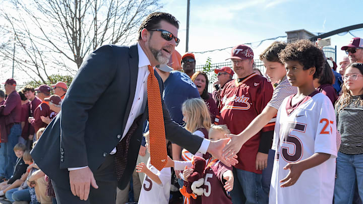 Nov 9, 2024; Blacksburg, Virginia, USA; Virginia Tech Hokies head coach Brent Pry greets fans before the game against the Clemson Tigers as he enters Lane Stadium. Mandatory Credit: Brian Bishop-Imagn Images Nov 9, 2024; Blacksburg, Virginia, USA; Virginia Tech Hokies head coach Brent Pry greets fans before the game against the Clemson Tigers as he enters Lane Stadium. Mandatory Credit: Brian Bishop-Imagn Images