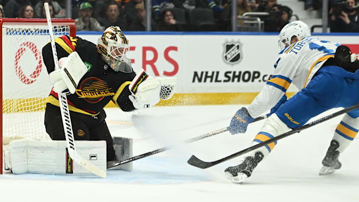 Mar 21, 2026; Vancouver, British Columbia, CAN; St. Louis Blues right wing Alexey Toropchenko (13) shoots the puck against Vancouver Canucks goaltender Kevin Lankinen (32) during the third period at Rogers Arena. Mandatory Credit: Simon Fearn-Imagn Images Mar 21, 2026; Vancouver, British Columbia, CAN; St. Louis Blues right wing Alexey Toropchenko (13) shoots the puck against Vancouver Canucks goaltender Kevin Lankinen (32) during the third period at Rogers Arena. Mandatory Credit: Simon Fearn-Imagn Images