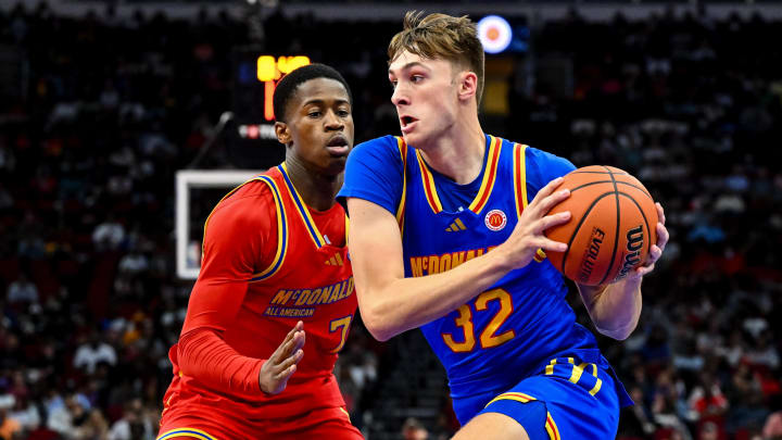 Apr 2, 2024; Houston, TX, USA; McDonald's All American East forward Cooper Flagg (32) controls the ball as McDonald's All American West guard Valdez Edgecombe Jr (7) defends during the first half at Toyota Center. Mandatory Credit: Maria Lysaker-USA TODAY Sports
