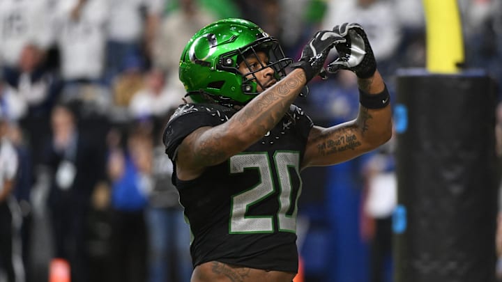 Oregon Ducks running back Jordan James (20) reacts after rushing for a touchdown against the Penn State Nittany Lions during the fourth quarter in the 2024 Big Ten Championship game at Lucas Oil Stadium.