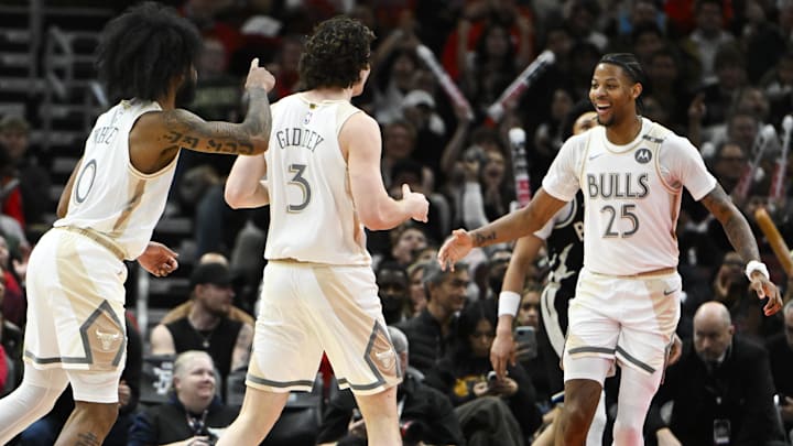 Dec 28, 2024; Chicago, Illinois, USA;  Chicago Bulls forward Dalen Terry (25) celebrates with Chicago Bulls guard Josh Giddey (3) and  guard Coby White (0) after scoring against the Milwaukee Bucks during the second half at the United Center. Mandatory Credit: Matt Marton-Imagn Images