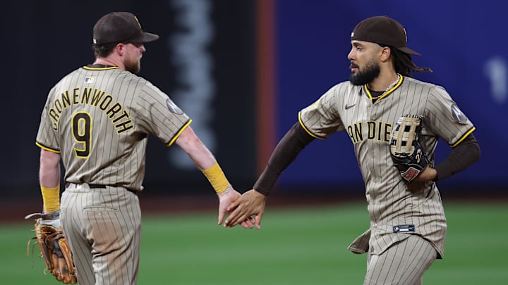 Sep 17, 2025; New York City, New York, USA; San Diego Padres second baseman Jake Cronenworth (9) celebrates with right fielder Fernando Tatis Jr. (23) after the game against the New York Mets at Citi Field. Mandatory Credit: Vincent Carchietta-Imagn Images Sep 17, 2025; New York City, New York, USA; San Diego Padres second baseman Jake Cronenworth (9) celebrates with right fielder Fernando Tatis Jr. (23) after the game against the New York Mets at Citi Field. Mandatory Credit: Vincent Carchietta-Imagn Images