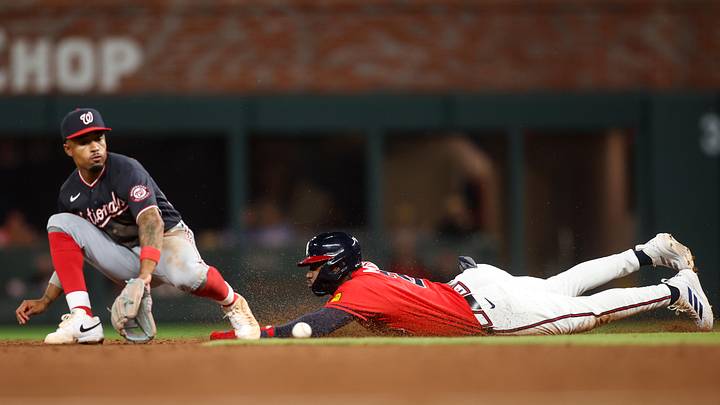 May 22, 2026; Atlanta, Georgia, USA; Atlanta Braves shortstop Jorge Mateo (2) slides safely into second with a stolen base past Washington Nationals second baseman Nasim Nunez (26) in the ninth inning at Truist Park. Mandatory Credit: Brett Davis-Imagn Images