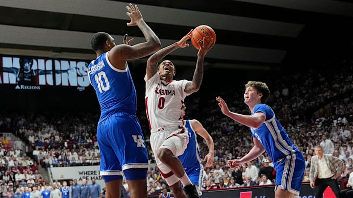Feb 22, 2025; Tuscaloosa, AL, USA; Alabama guard Labaron Philon (0) goes to the hoop against Kentucky forward Brandon Garrison (10) and Kentucky forward Trent Noah (9) at Coleman Coliseum. Alabama defeated Kentucky 96-83. Mandatory Credit: Gary Cosby Jr.-Tuscaloosa News