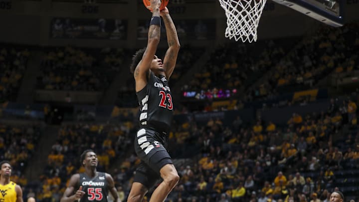 Feb 19, 2025; Morgantown, West Virginia, USA; Cincinnati Bearcats forward Dillon Mitchell (23) dunks the ball during the second half against the West Virginia Mountaineers at WVU Coliseum. Mandatory Credit: Ben Queen-Imagn Images