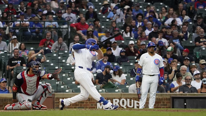 Sep 22, 2024; Chicago, Illinois, USA; Chicago Cubs first baseman Michael Busch (29) hits a home run against the Washington Nationals during the fourth inning at Wrigley Field.