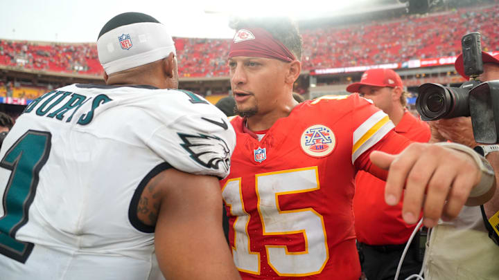 Sep 14, 2025; Kansas City, Missouri, USA; Philadelphia Eagles quarterback Jalen Hurts (1) and Kansas City Chiefs quarterback Patrick Mahomes (15) greet eachother after the game at GEHA Field at Arrowhead Stadium. Mandatory Credit: Jay Biggerstaff-Imagn Images