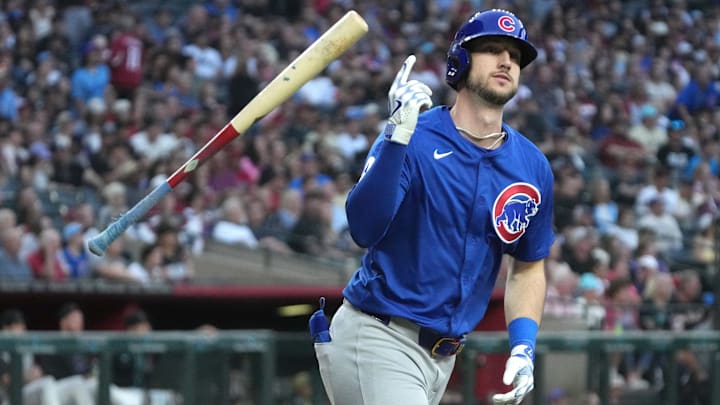 Mar 29, 2025; Phoenix, Arizona, USA; Chicago Cubs outfielder Kyle Tucker (30) hits a two-run home run against the Arizona Diamondbacks in the fifth inning at Chase Field. Mandatory Credit: Rick Scuteri-Imagn Images