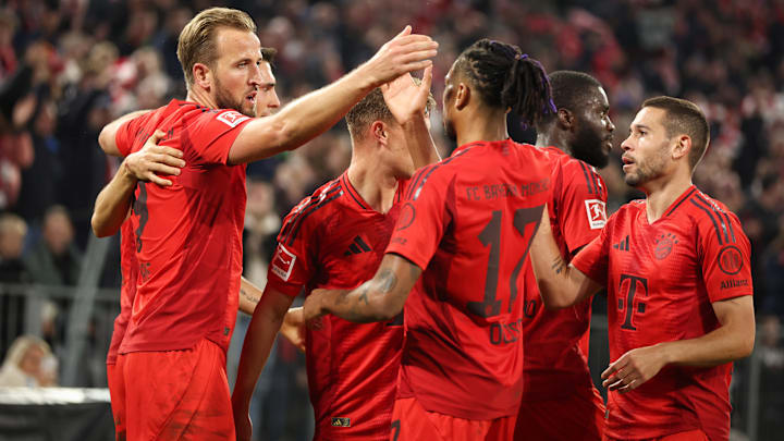 Bayern Munich players celebrating Harry Kane's goal against VfB Stuttgart.
