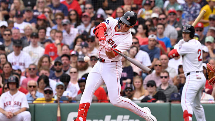 Sep 1, 2025; Boston, Massachusetts, USA; Boston Red Sox right fielder Roman Anthony (19) hits a single against the Cleveland Guardians during the second inning at Fenway Park. Mandatory Credit: Eric Canha-Imagn Images