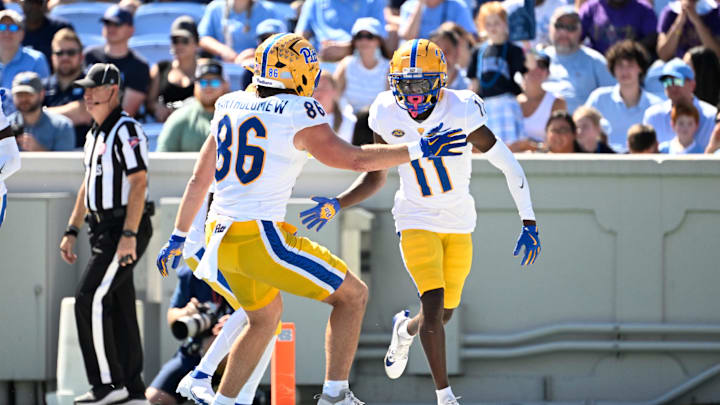 Oct 5, 2024; Chapel Hill, North Carolina, USA;  Pittsburgh Panthers wide reciever Censere Lee (11) celebrates with tight end Gavin Bartholomew (86) after scoring a touchdown in the second quarter at Kenan Memorial Stadium. Mandatory Credit: Bob Donnan-Imagn Images