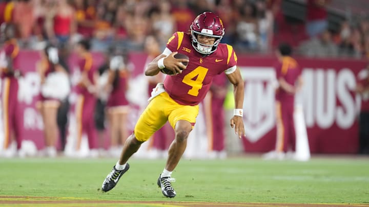 Aug 30, 2025; Los Angeles, California, USA; Southern California Trojans quarterback Husan Longstreet (4) carries the ball against the Missouri State Bears in the second half at United Airlines Field at Los Angeles Memorial Coliseum. Mandatory Credit: Kirby Lee-Imagn Images