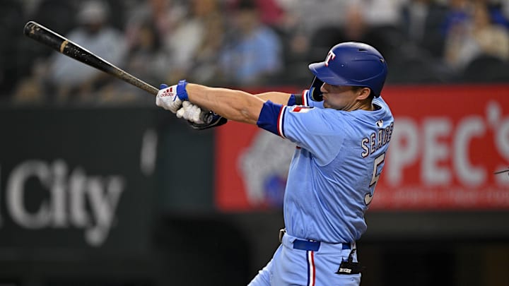 Apr 20, 2025; Arlington, Texas, USA; Texas Rangers shortstop Corey Seager (5) bats during the game between the Texas Rangers and the Los Angeles Dodgers at Globe Life Field. 