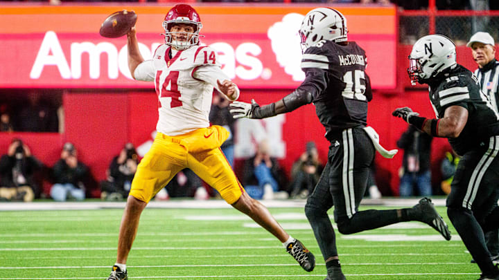 Jayden Maiava looks to pass against Dasan McCullough during the fourth quarter.