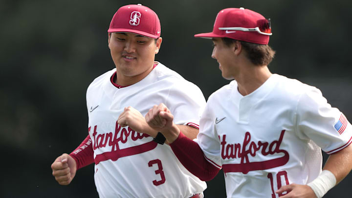 Feb 28, 2025; Stanford, CA, USA; Stanford Cardinal first baseman Rintaro Sasaki (3) bumps fists with center fielder Charlie Bates (10) before the game against the Xavier Musketeers at Sunken Diamond. Mandatory Credit: Darren Yamashita-Imagn Images