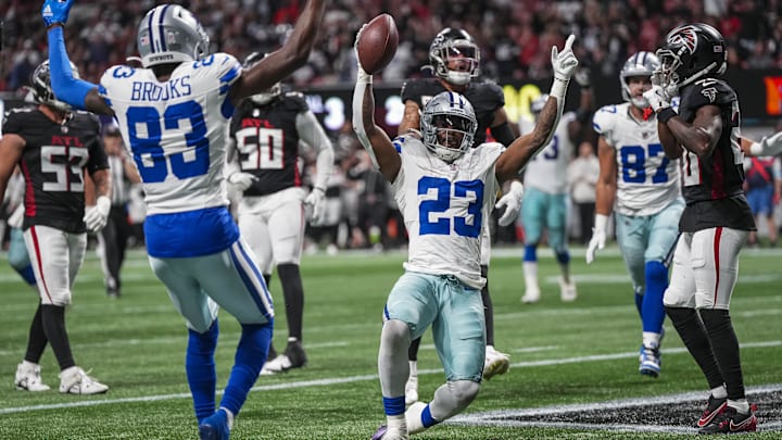 Dallas Cowboys running back Rico Dowdle (23) reacts after making a juggling catch for a touchdown against the Atlanta Falcons during the first half at Mercedes-Benz Stadium. 