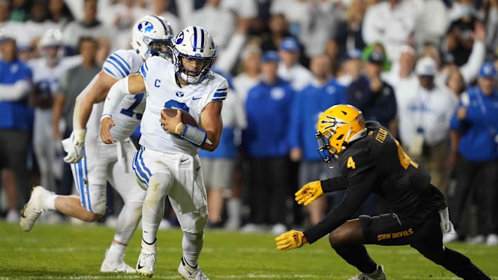 Sep 18, 2021; Provo, Utah, USA; BYU Cougars quarterback Jaren Hall (3) is pursued by Arizona State Sun Devils defensive back Evan Fields (4) in the fourth quarter at LaVell Edwards Stadium. Mandatory Credit: Kirby Lee-Imagn Images
