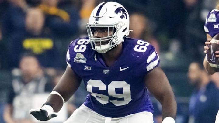 Dec 26, 2024; Phoenix, AZ, USA; Kansas State Wildcats offensive lineman Taylor Poitier (69) against the Rutgers Scarlet Knights during the Rate Bowl at Chase Field. Mandatory Credit: Mark J. Rebilas-Imagn Images Dec 26, 2024; Phoenix, AZ, USA; Kansas State Wildcats offensive lineman Taylor Poitier (69) against the Rutgers Scarlet Knights during the Rate Bowl at Chase Field. Mandatory Credit: Mark J. Rebilas-Imagn Images