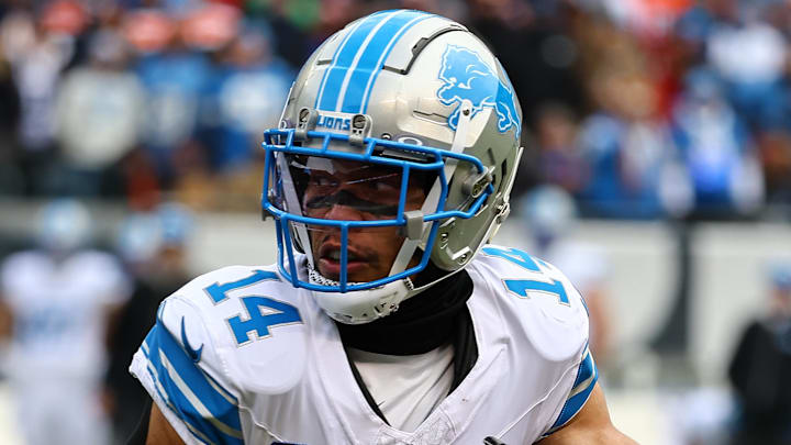 Dec 22, 2024; Chicago, Illinois, USA; Detroit Lions wide receiver Amon-Ra St. Brown (14) makes a catch against the Chicago Bears during the first quarter at Soldier Field. Mandatory Credit: Mike Dinovo-Imagn Images